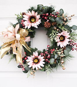 Christmas Wreath with Pink Sunflowers at Elegant Floral Wreaths at Etsy. 